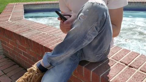 Young man using a smartphone 스톡 동영상 75641739