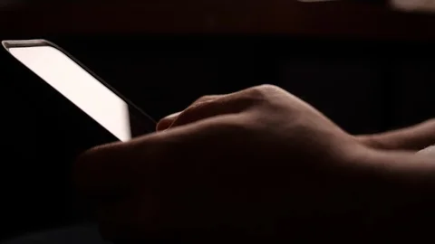 Young man using smartphone at home on night. Stock Footage 125963416