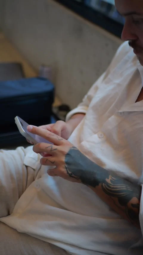Young Man Using Smartphone Indoors, Mobile Technology and Online... Stock Footage 334437412