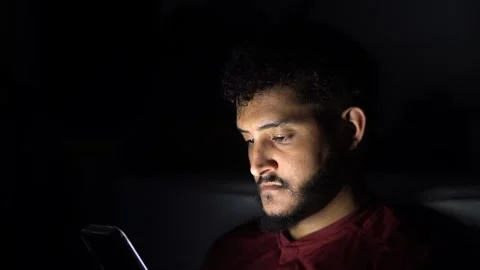 Young man using smartphone at night in the dark Video stock 301088040