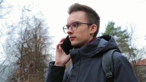 Young man using smartphone outdoors Video stock 302803527