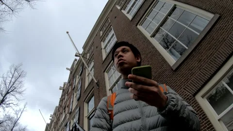 Young Man Using Smartphone Outdoors Stock Footage 314591914