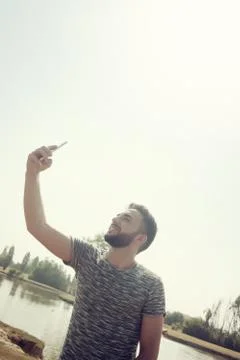 Young man using smartphone Stock Photos