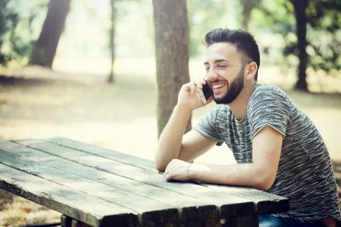 Young man using smartphone Stock Photos