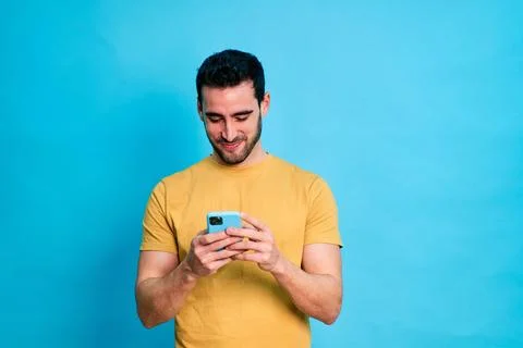 Young man using a smartphone Stock Photos