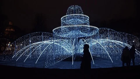 Young man using smartphone standing alone outdoors at night Stock Footage 83631008