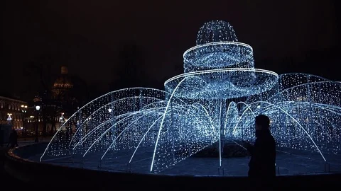 Young man using smartphone standing alone outdoors at night Stock Footage 83631061