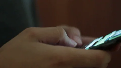 Young man using smartphone while doing homework. Stock Footage 119820407