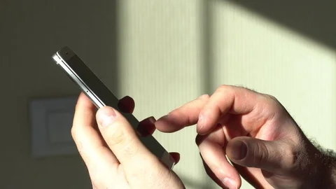 Young man using smartphone while doing homework. Young people and college Stock Footage 128702480
