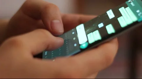 Young man using smartphone while doing homework. Stock Footage 139016679