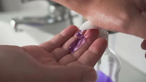 Young Man using a Soap Dispenser, one hit Stock Footage 139050505