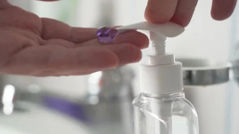 Young Man using a Soap Dispenser, two hits Stock Footage 139050506
