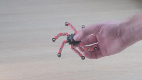 Young man using spinner toy, man hand playing with transformer spinner, phy.. Stock Footage 330124703