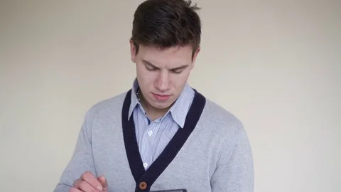 Young man using the tablet on the background. 4K 스톡 동영상 70183498