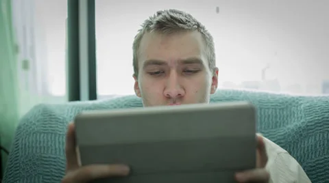 Young Man Using Tablet Computer Touchscreen Видео 36368082