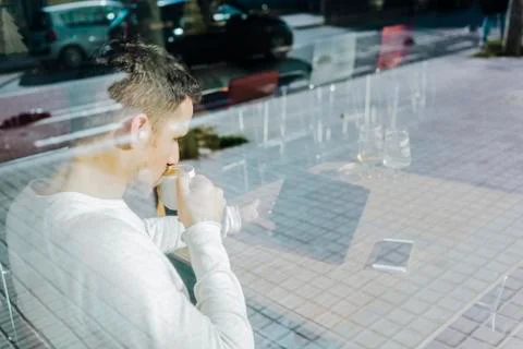 Young man using tablet computer in cafe 스톡 사진