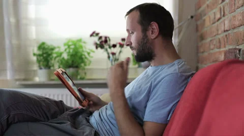 Young man using a tablet Video stock 31669171