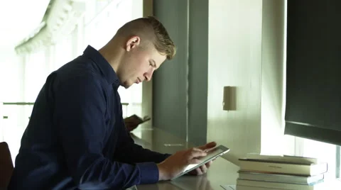 Young man using tablet Stock Footage 67364714