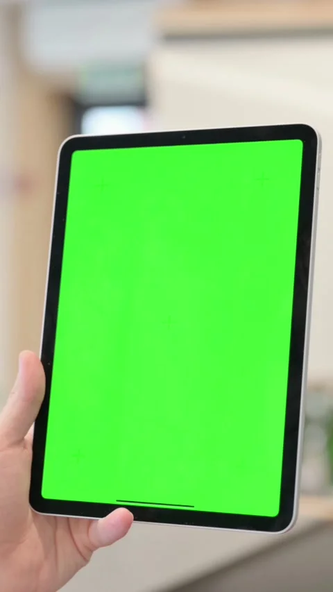 Young Man Using Tablet with Green Chroma Screen, Vertical Video Vídeos de archivo 340034179