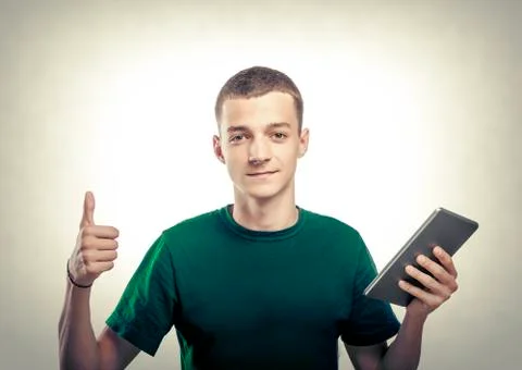 Young man using tablet pc Stock Photos