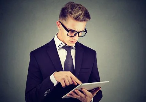 Young man using a tablet pc Stock Photos