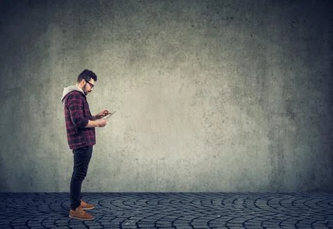 Young man using a tablet pc Stock Photos
