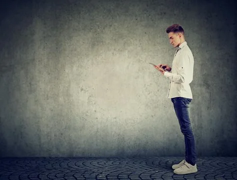 Young man using a tablet pc Stock Photos