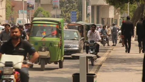 Young man using talking on mobile while riding his motorcycle Stock Footage 86623889