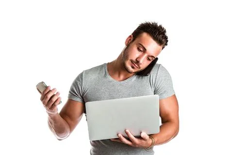 Young man using too many devices at the same time Stock Photos