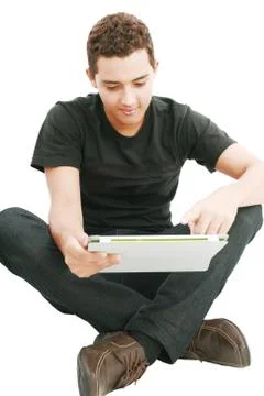 Young man using a touch pad pc, isolated on white Stock Photos