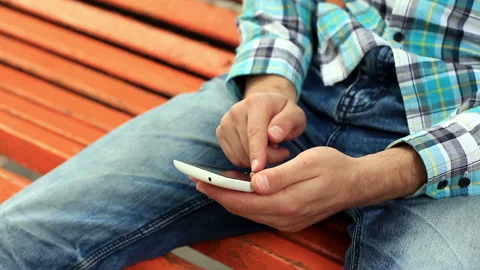 Young Man Using Touchscreen Phone Stock Footage 120123383
