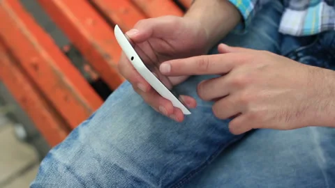 Young Man Using Touchscreen Phone Stock Footage 120123415