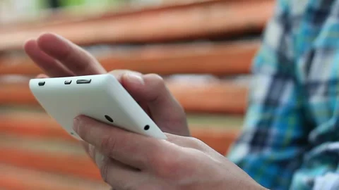 Young Man Using Touchscreen Phone Stock Footage 120123609