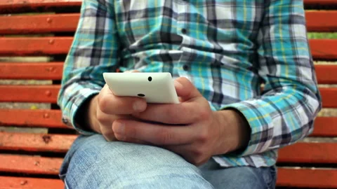 Young Man Using Touchscreen Phone Stock Footage 120124098