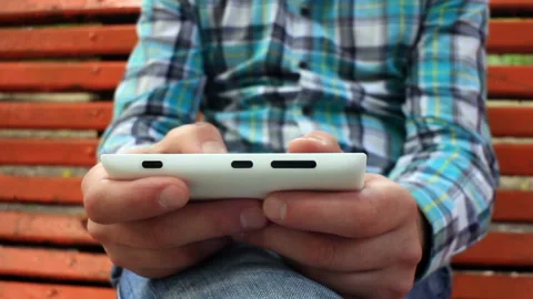 Young Man Using Touchscreen Phone Stock Footage 120124120