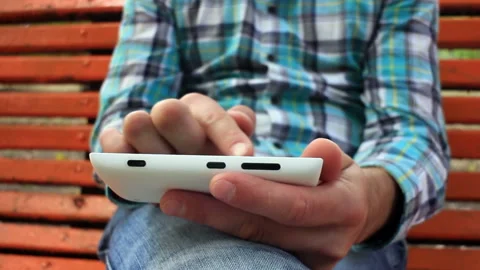 Young Man Using Touchscreen Phone Stock Footage 120124213