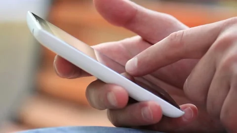 Young Man Using Touchscreen Phone Stock Footage 120124652