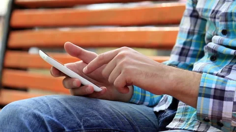 Young Man Using Touchscreen Phone Stock Footage 120124779