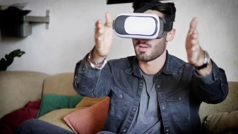 Young man using virtual reality viewer Stock Photos