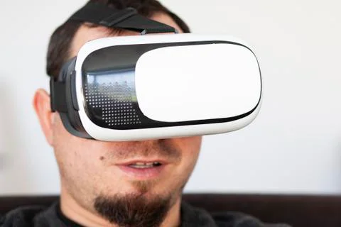 Young man using virtual reality headset Stock Photos