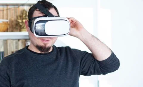 Young man using virtual reality headset Stock Photos