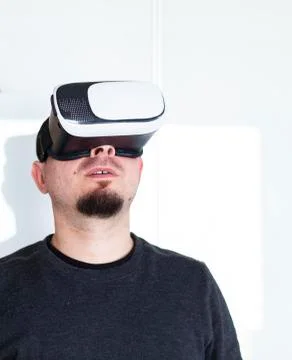 Young man using virtual reality headset Stock Photos
