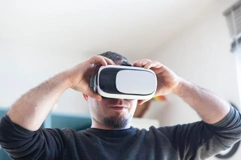 Young man using virtual reality headset Stock Photos