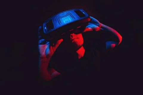 Young man using virtual reality headset VR. education online, studying concept Stock Photos