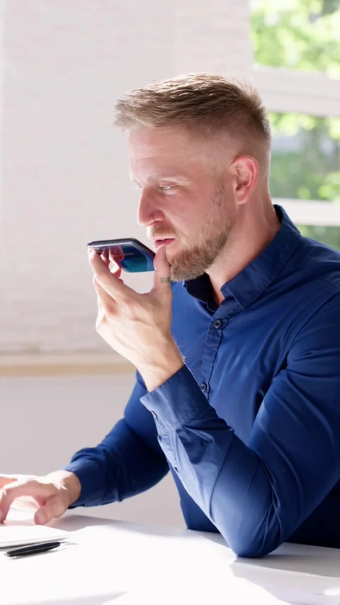 Young Man Using Voice Recognition Function Stock Footage 241968842