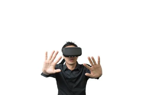 Young man using a VR headset and experiencing virtual reality Stock Photos