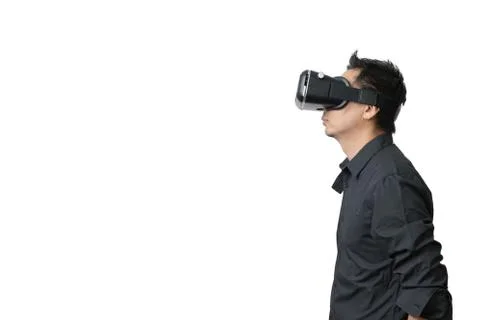 Young man using a VR headset and experiencing virtual reality Stock Photos