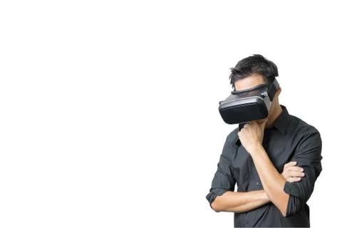 Young man using a VR headset and experiencing virtual reality Stock Photos