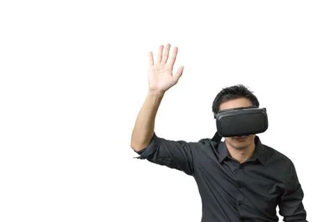 Young man using a VR headset and experiencing virtual reality Stock Photos