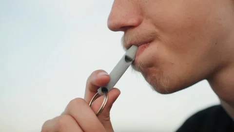 Young man vaping. Closeup of young man vaping during calm evening. Profile shot Stock Footage 332368631